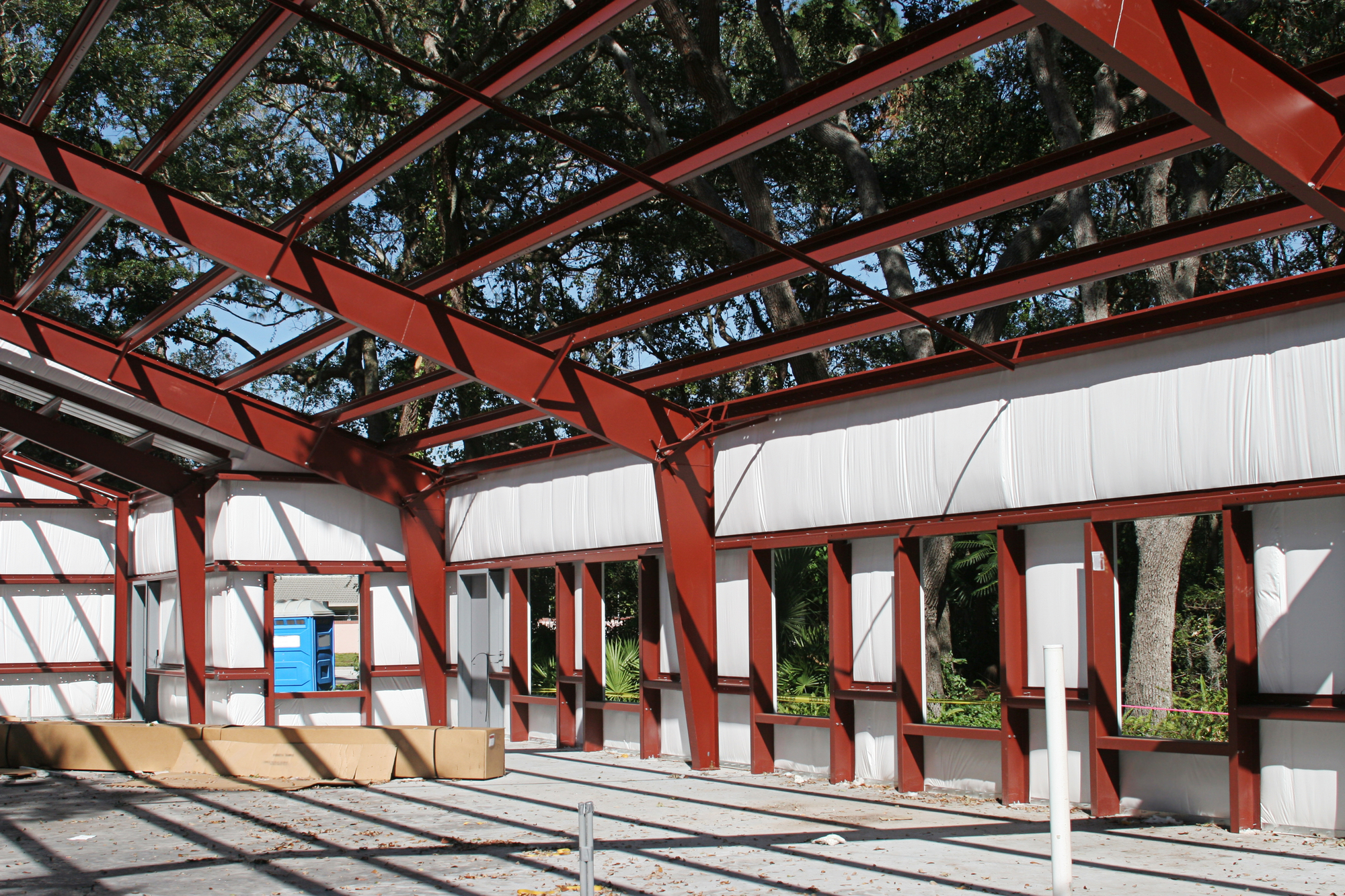 The walls and roof of a steel frame building under construction.