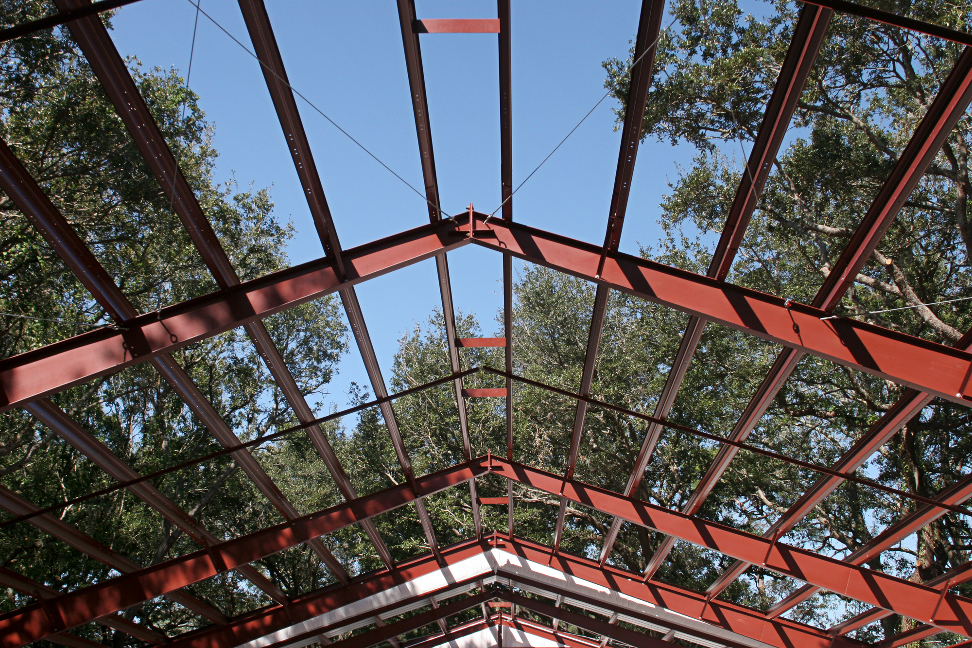 The steel beams of a roof in a newly constructed steel home.