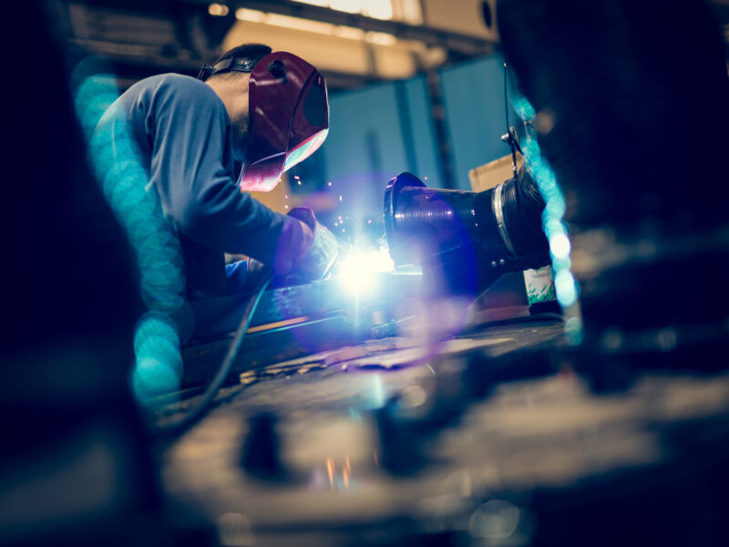 worker using mig welder worker using mig welder